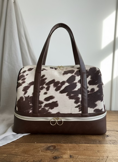 Shaye Cow Print Travel Bag