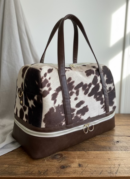 Shaye Cow Print Travel Bag